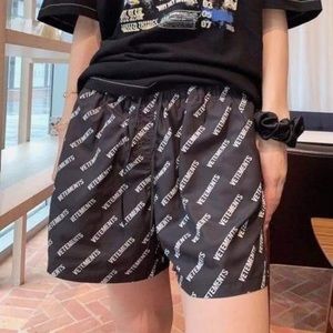 V Black Logo Unisex Swim Trunks